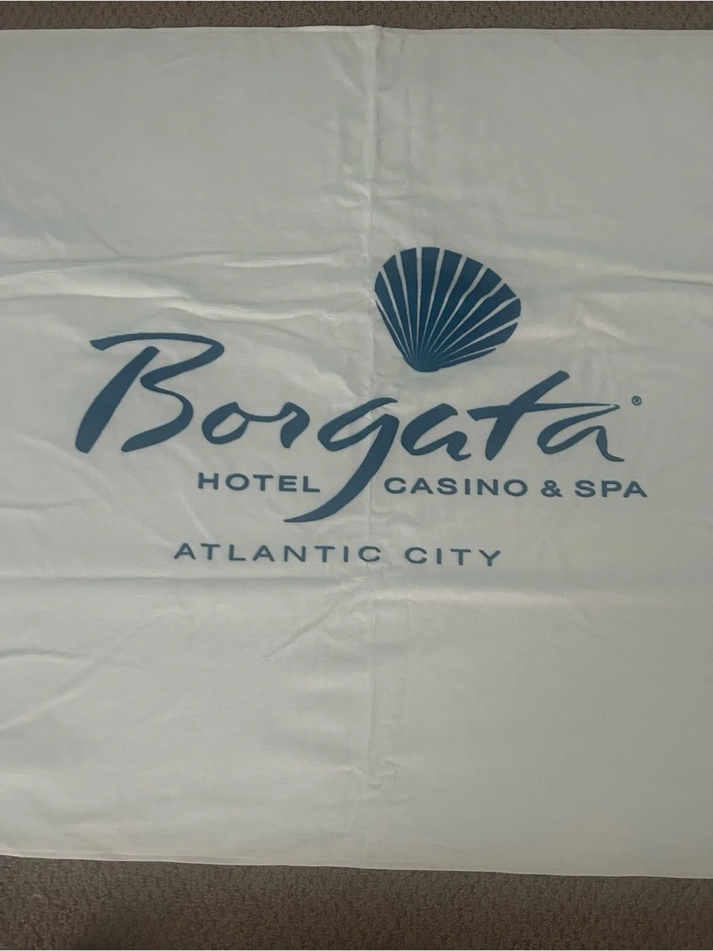 Borgata casino Atlantic City White Beach Towel with Blue Shell Motif